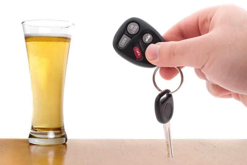 car keys and a beer glass