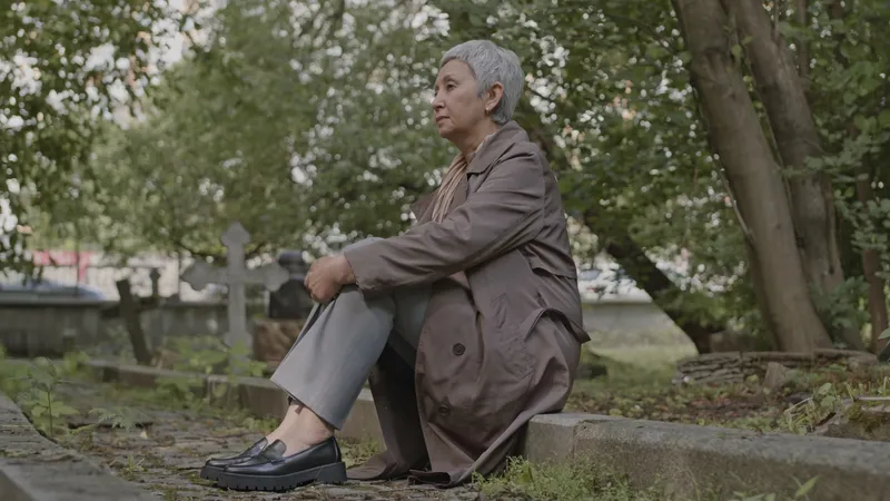 a mouring widow sitting outside