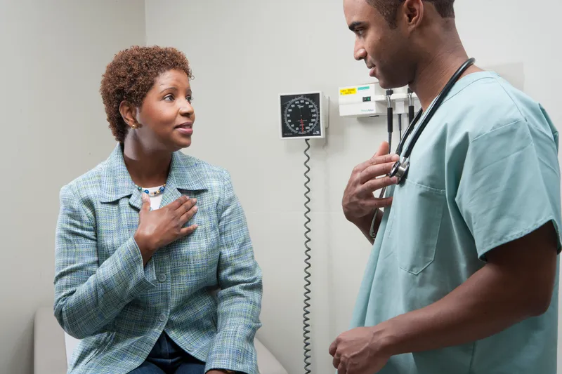 a doctor reccomending treatment to his patient.