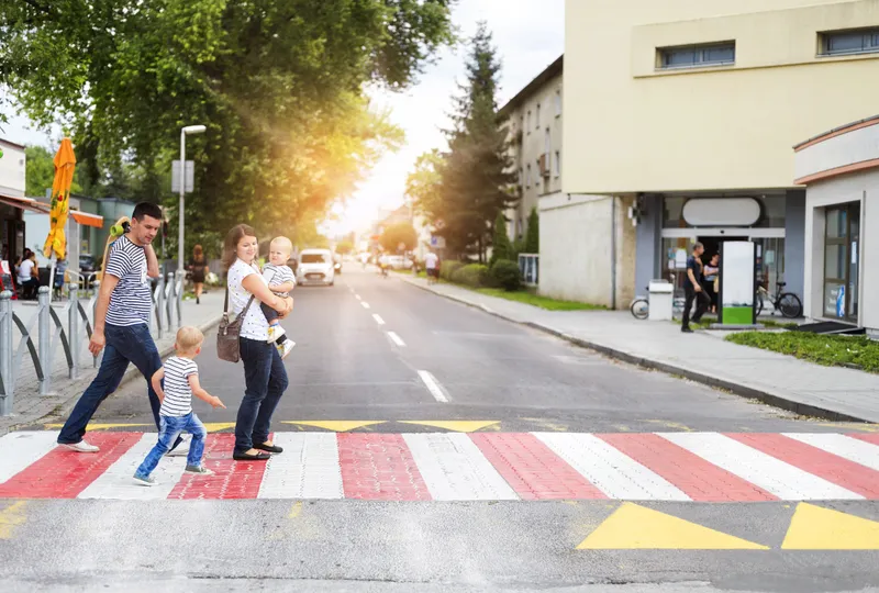 A family in a crosswalk