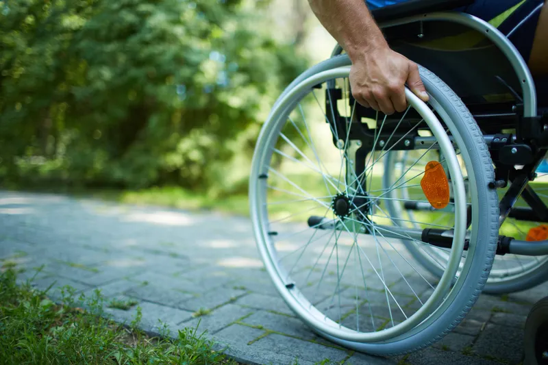 a wheelchair user in a park